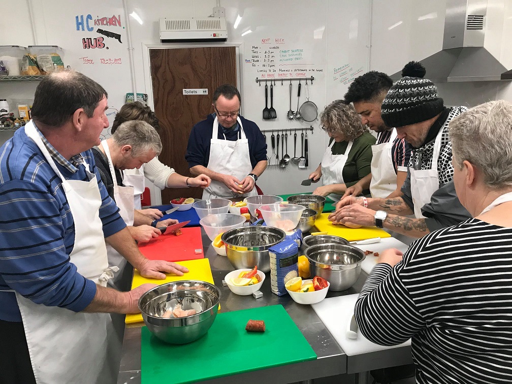 Group of people learning cookery